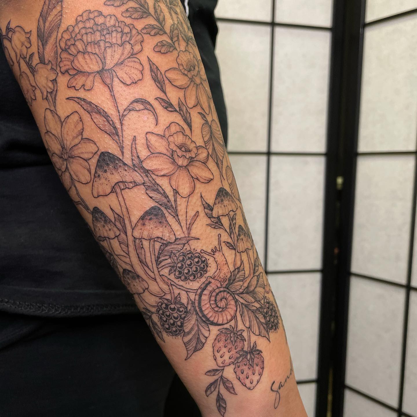 Floral and fruit design black and grey tattoo on the forearm by @jettaturas, New City, New York
