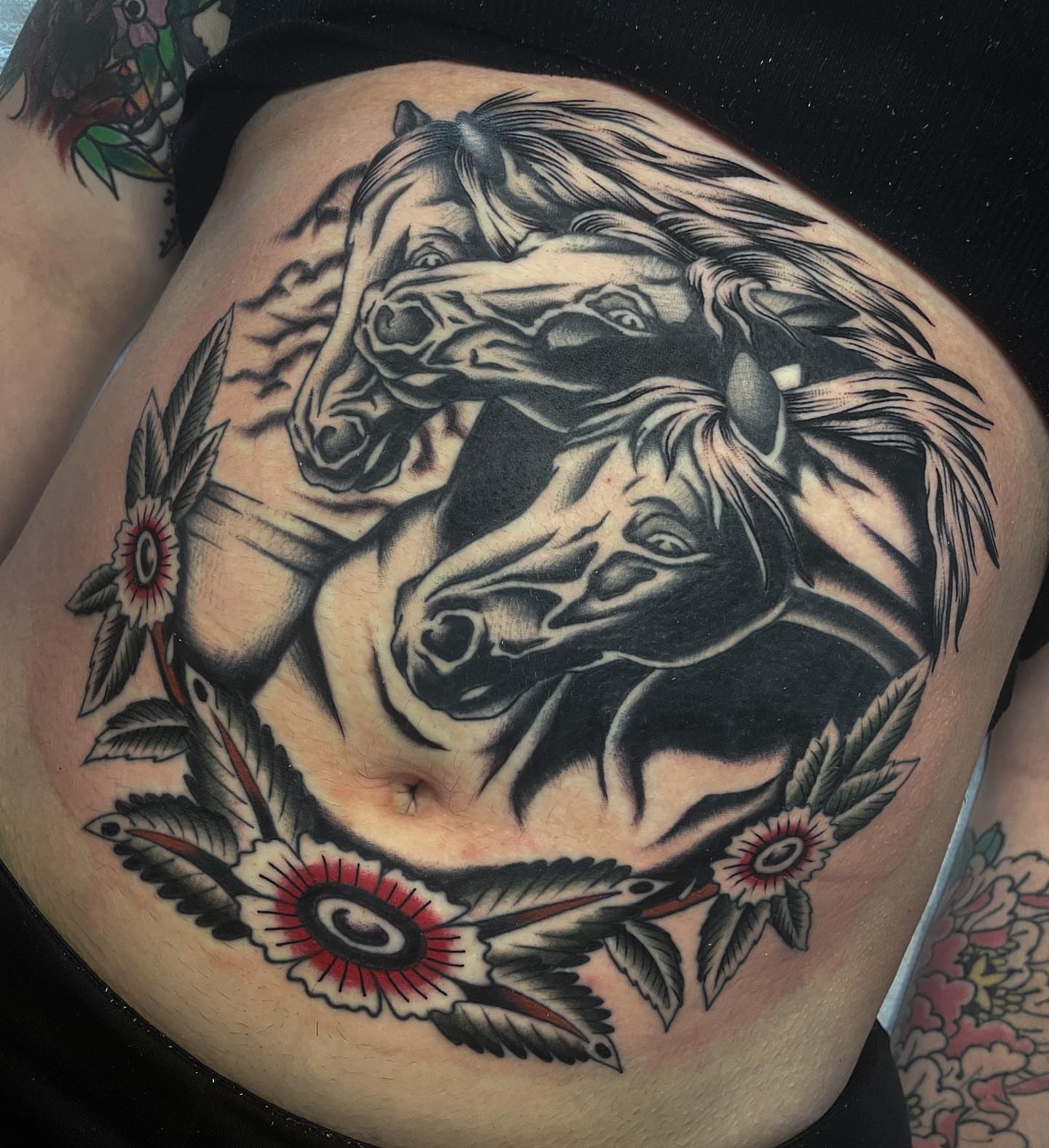 Horses American traditional tattoo on the torso by Toulouse Noble, Portland, Oregon