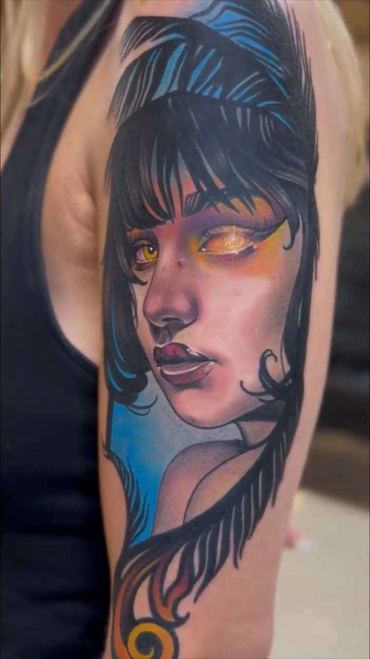 Woman with yellow eyes realism tattoo by Anthony Michaels, Tucson, Arizona