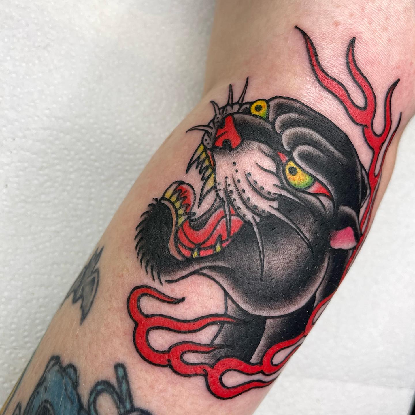 Panther American traditional tattoo on the forearm by Lexx Christine