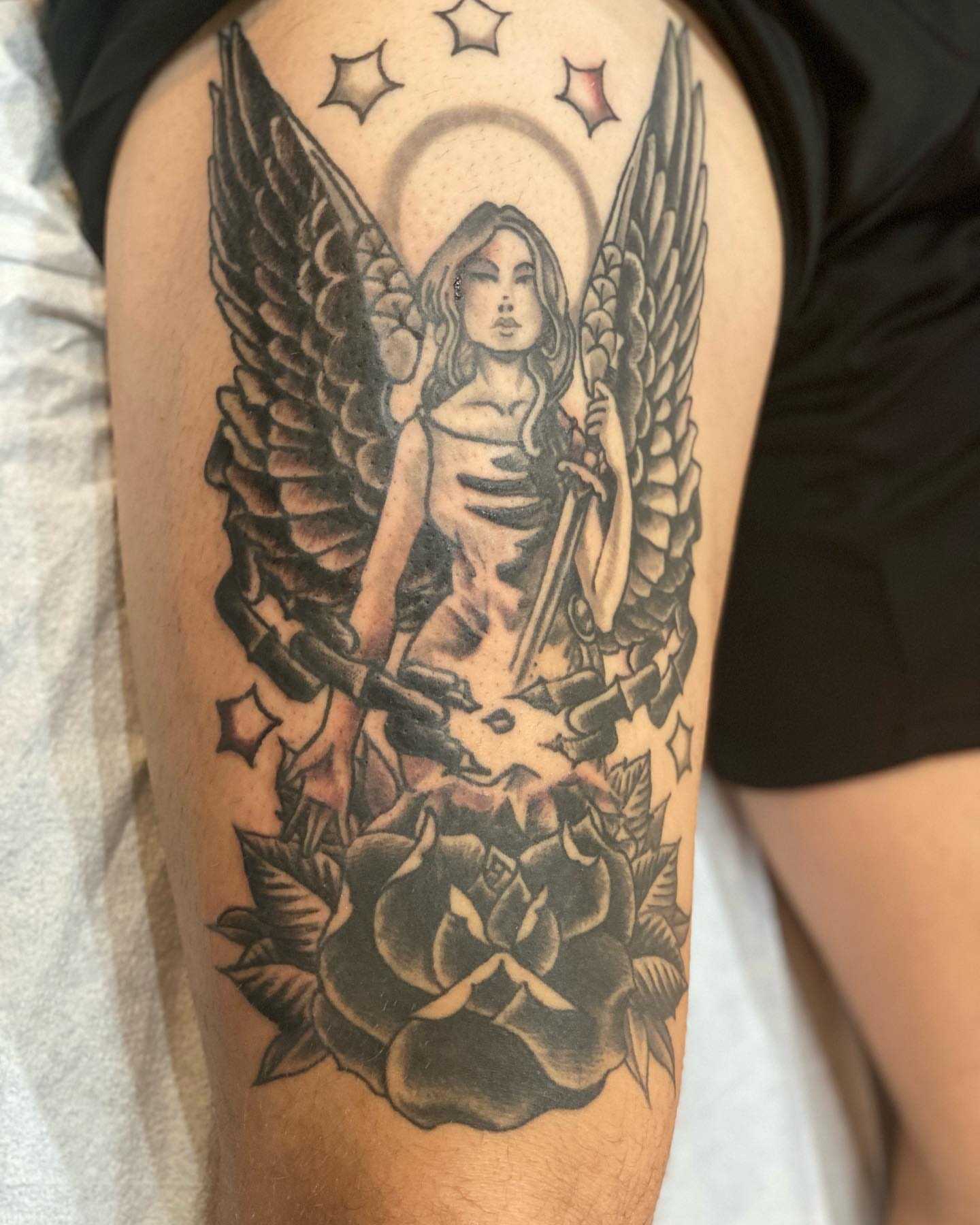 Angel with sword black and grey tattoo on the thigh by Christopher Sanders