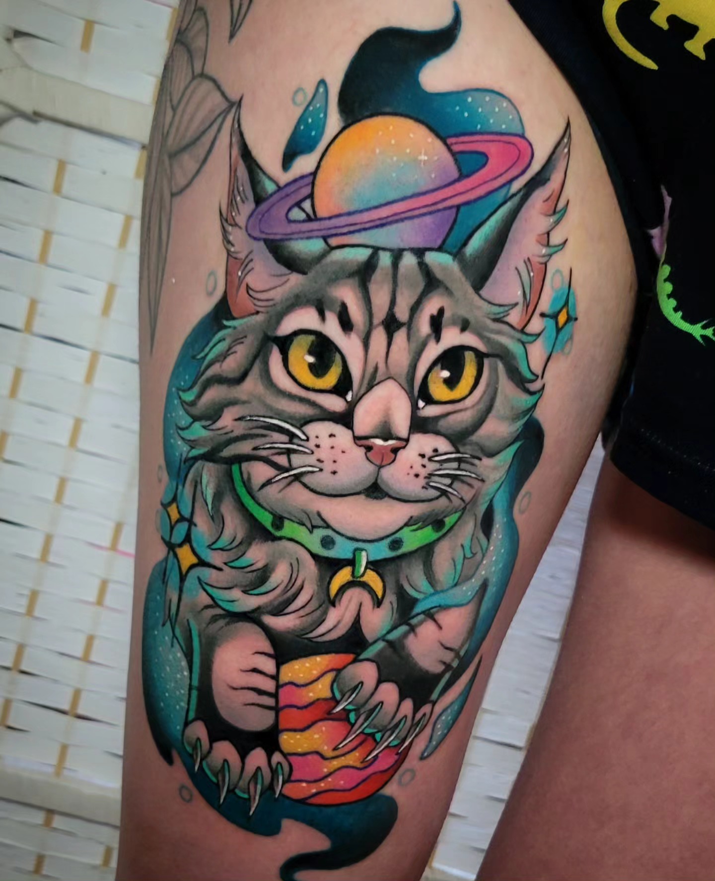Cat with Saturn new school tattoo on the thigh by @lovelornpotato