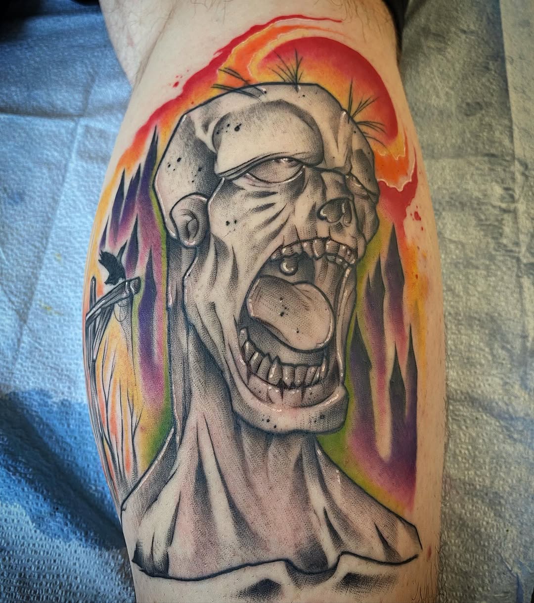 Zombie head with colorful background realism tattoo on the forearm by Cody Wolfe