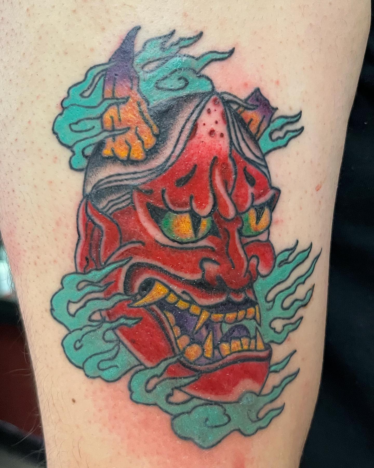 Demon mask American traditional tattoo on the forearm by Rebecca Lang