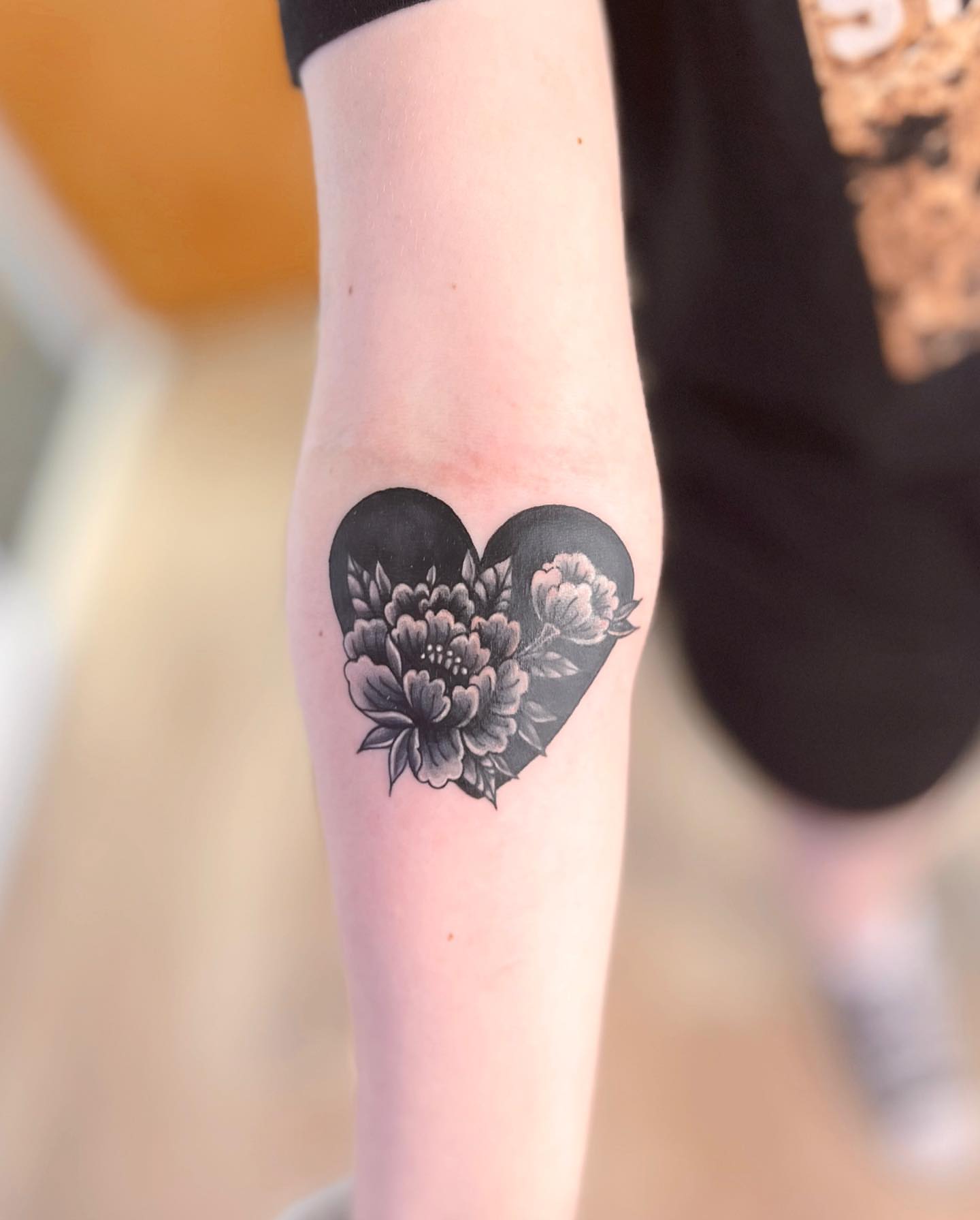 Heart with flowers black and grey tattoo on the forearm by πππ¦