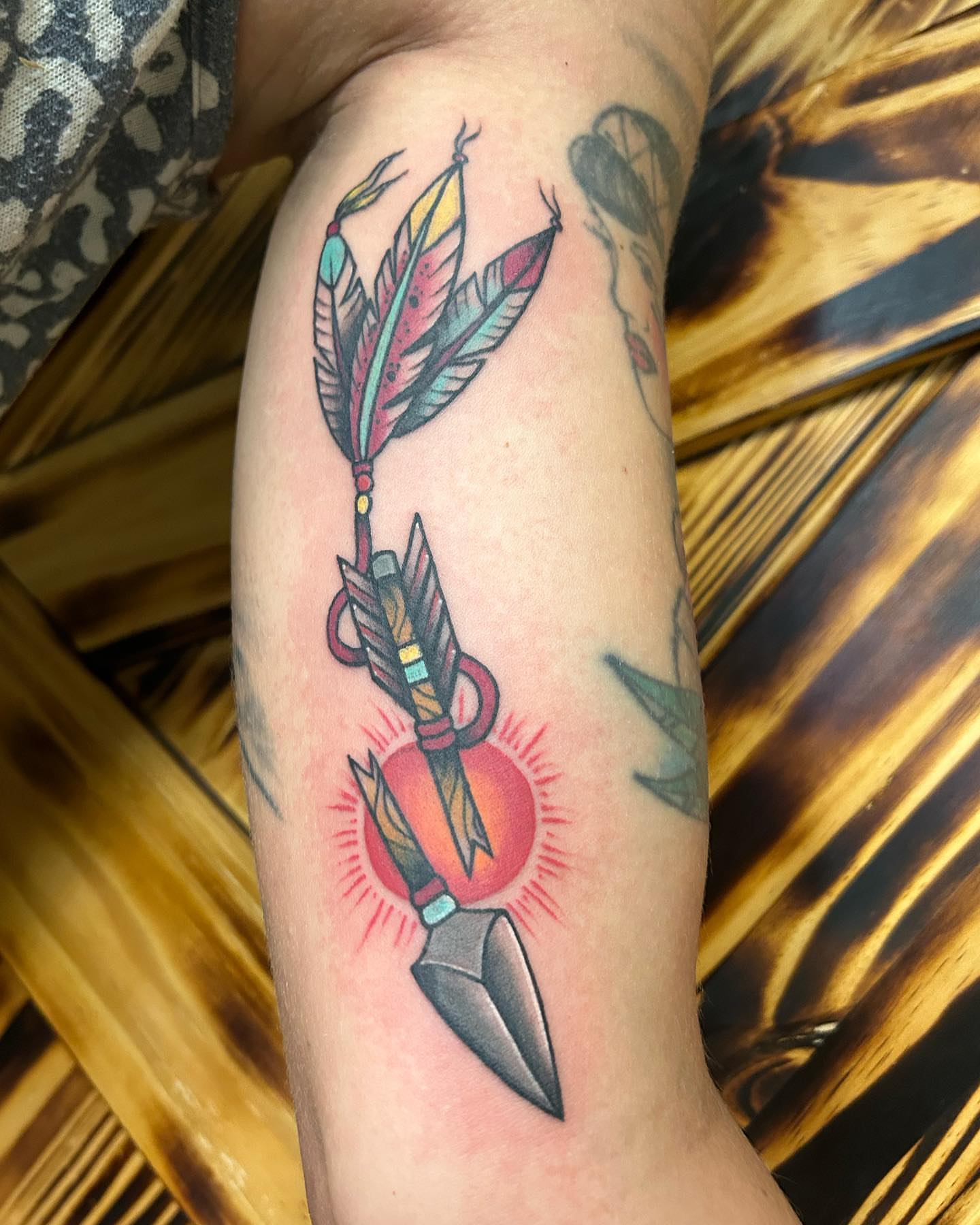 Arrow with feathers American traditional tattoo on the forearm by ππππππ ππππππ