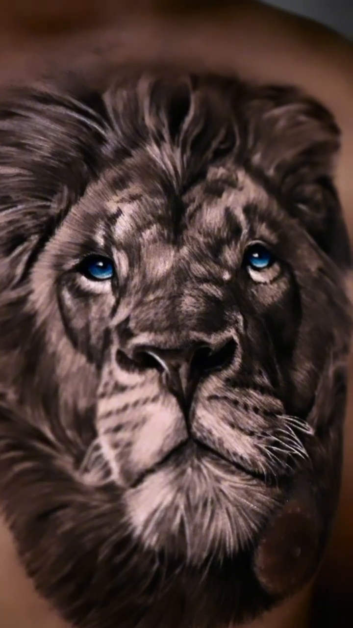 Lion portrait realism tattoo by Luis Bravo