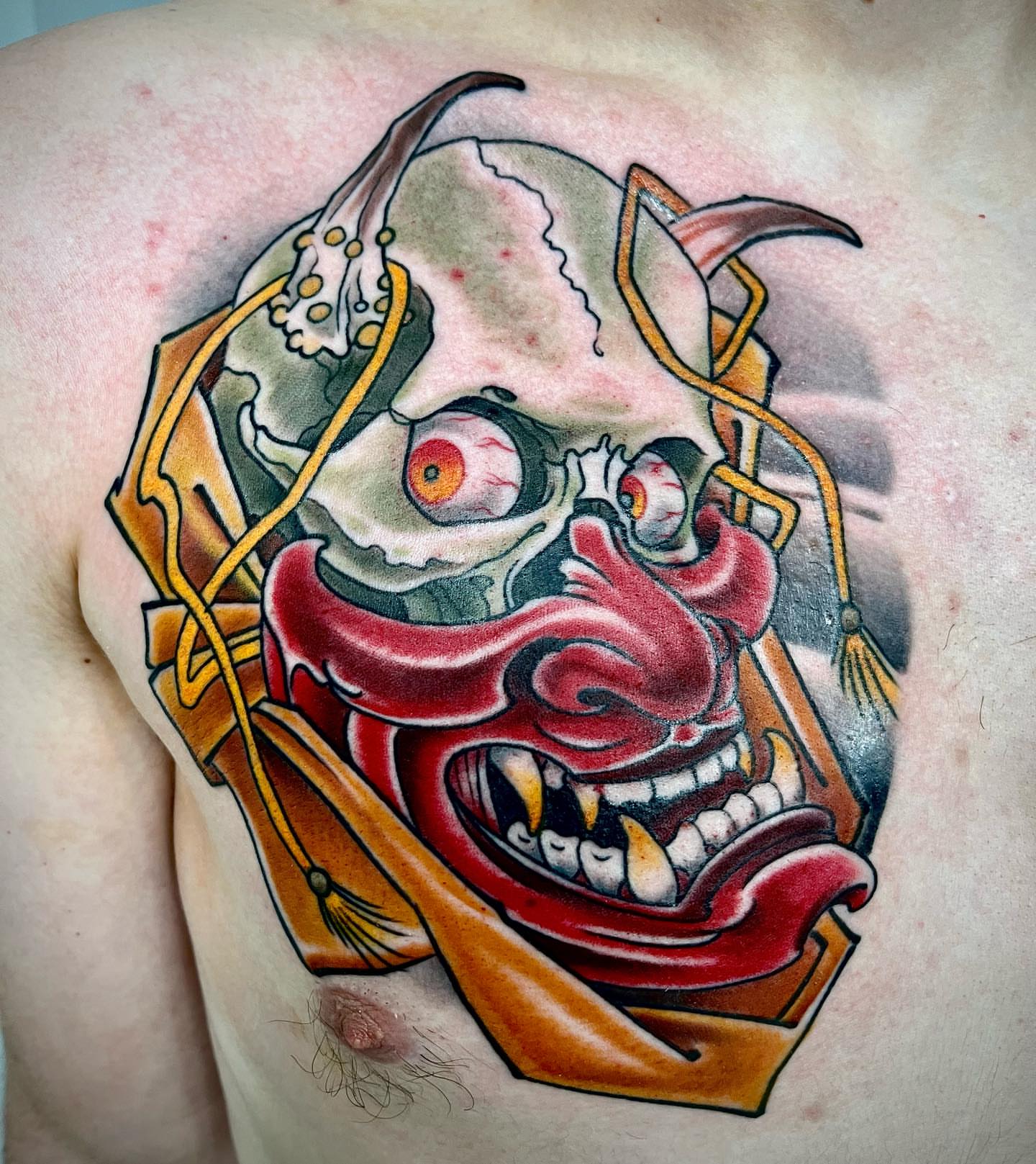 Demon mask japanese irezumi tattoo on the chest by biggstattoos