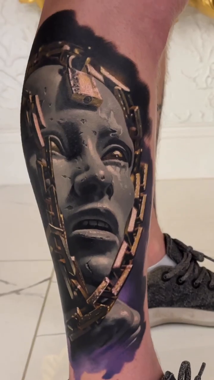 Surreal portrait with mechanical elements surrealism tattoo on the calf by Jacob Sheffield, Grand Junction, Colorado
