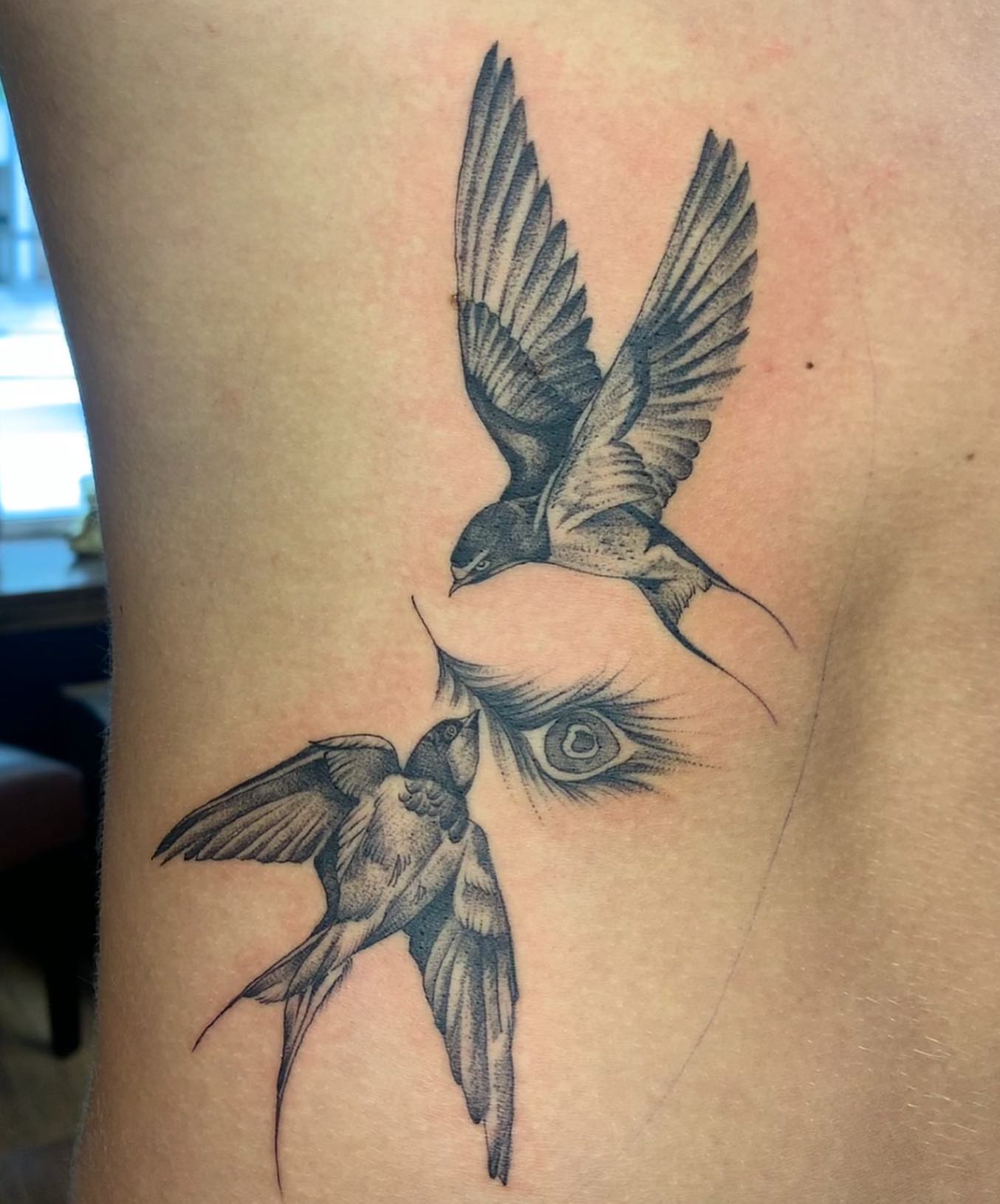 Birds and eye dotwork tattoo on the ribs by Jacob Deirfield, Circleville, Ohio