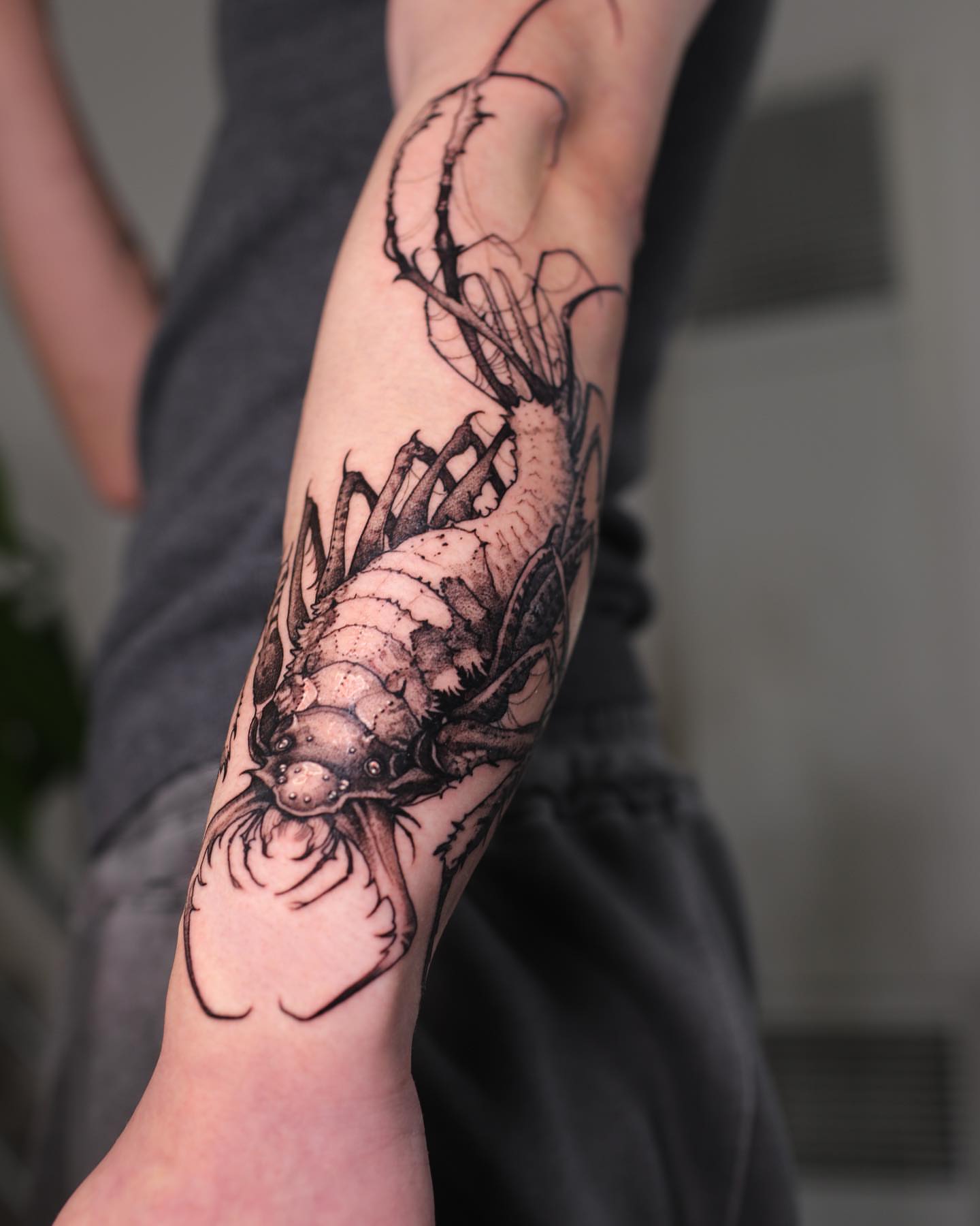 Fish realism tattoo on the forearm by Strokin Konstantin