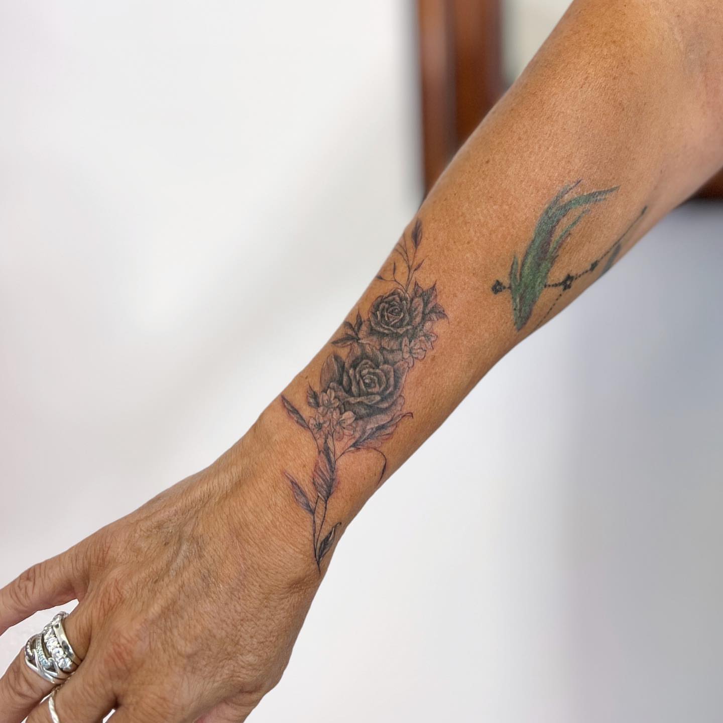 Roses and dragonfly black and grey tattoo on the forearm by πππ¦
