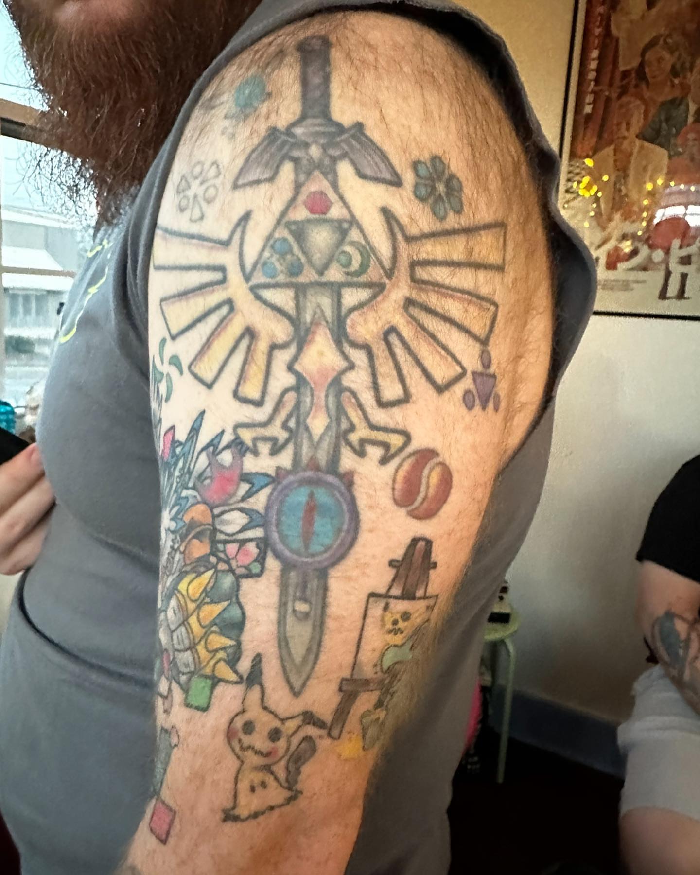 Zelda triforce geometric tattoo on the forearm by Erin Miller