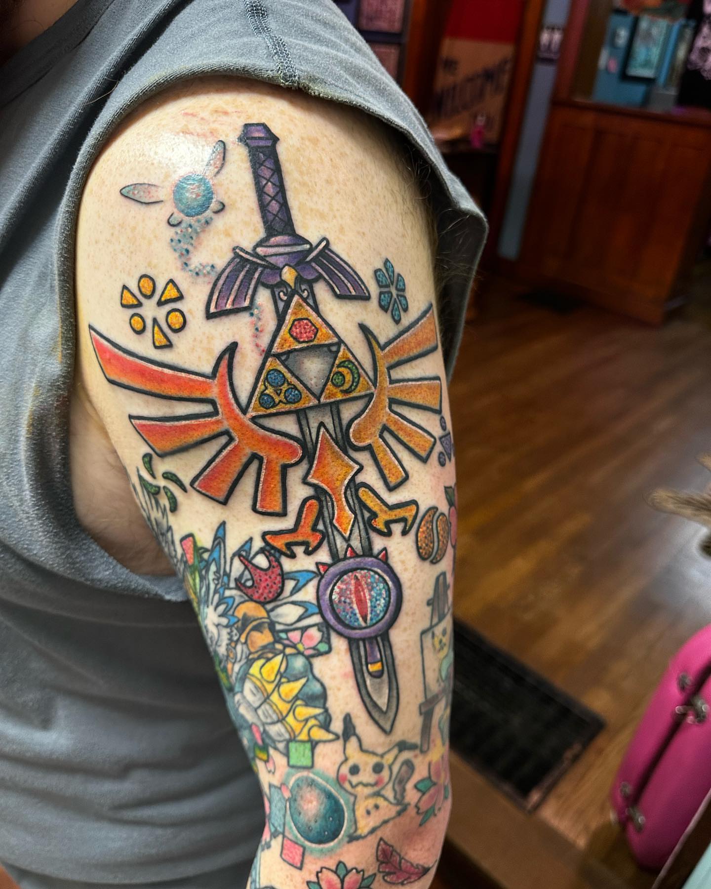 Legendary symbols geometric tattoo on the forearm by Erin Miller