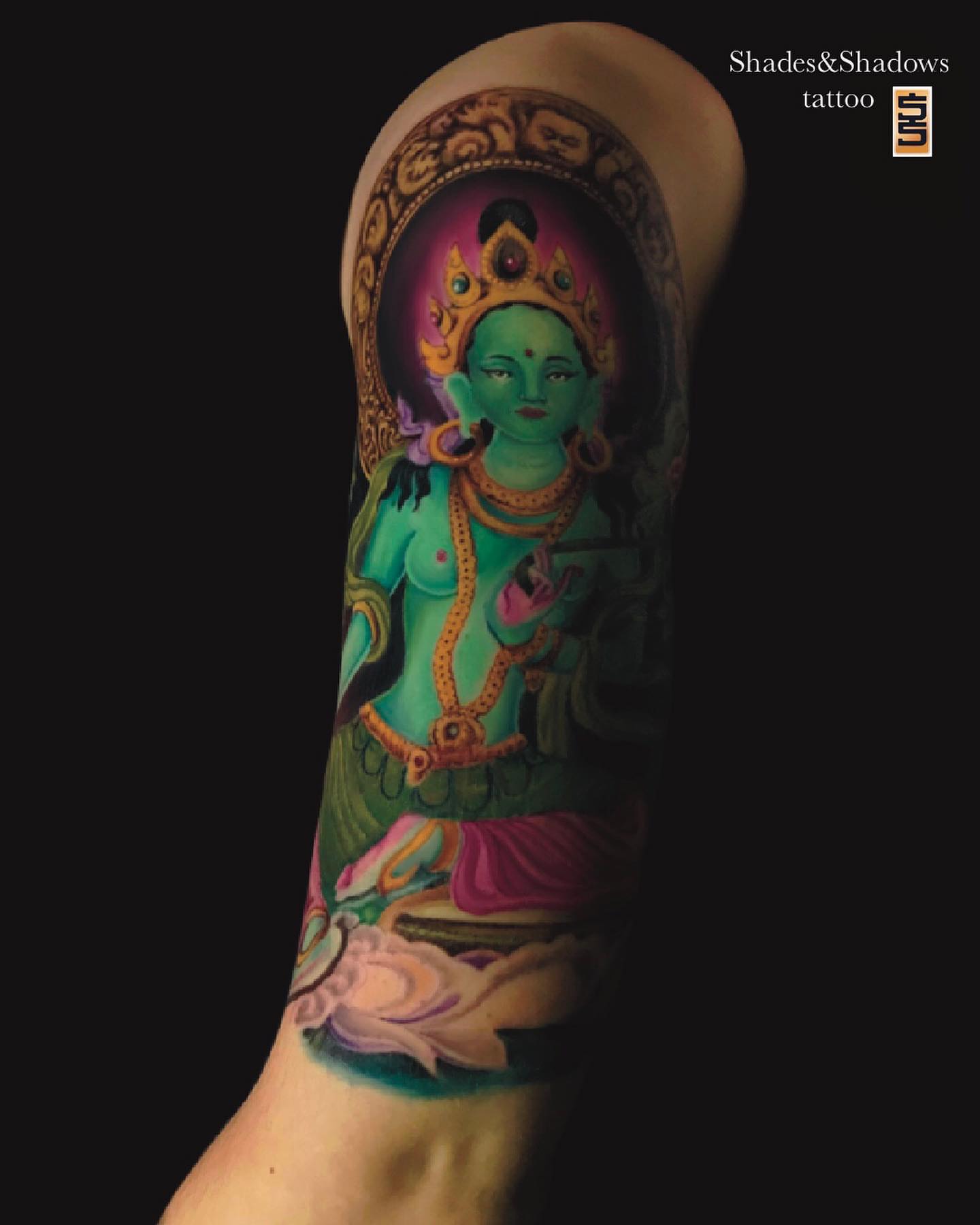 Buddha-like figure realism tattoo on the forearm by Austin Tattoo Artist