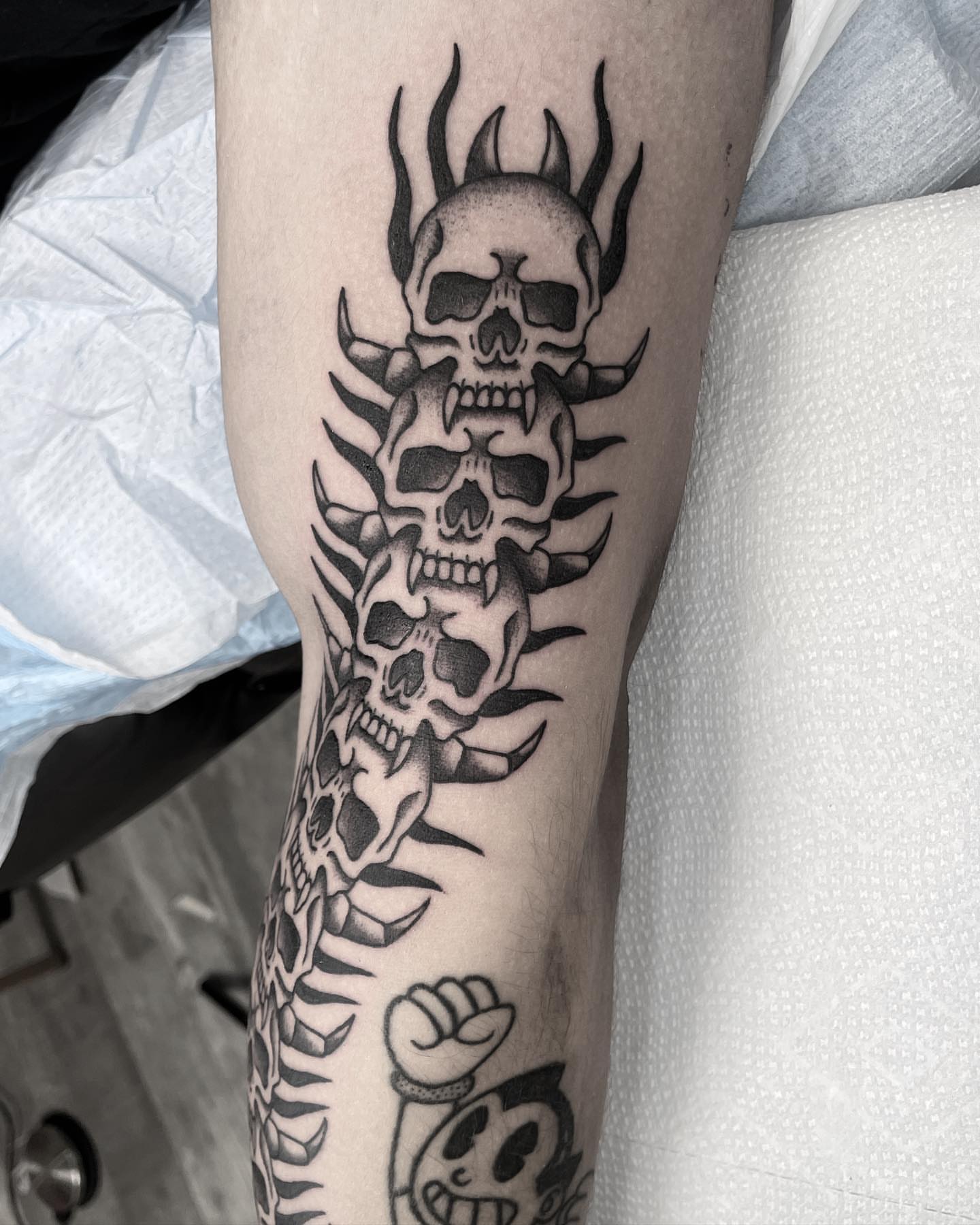 Skulls black and grey tattoo on the forearm by Jenn ★ Reid