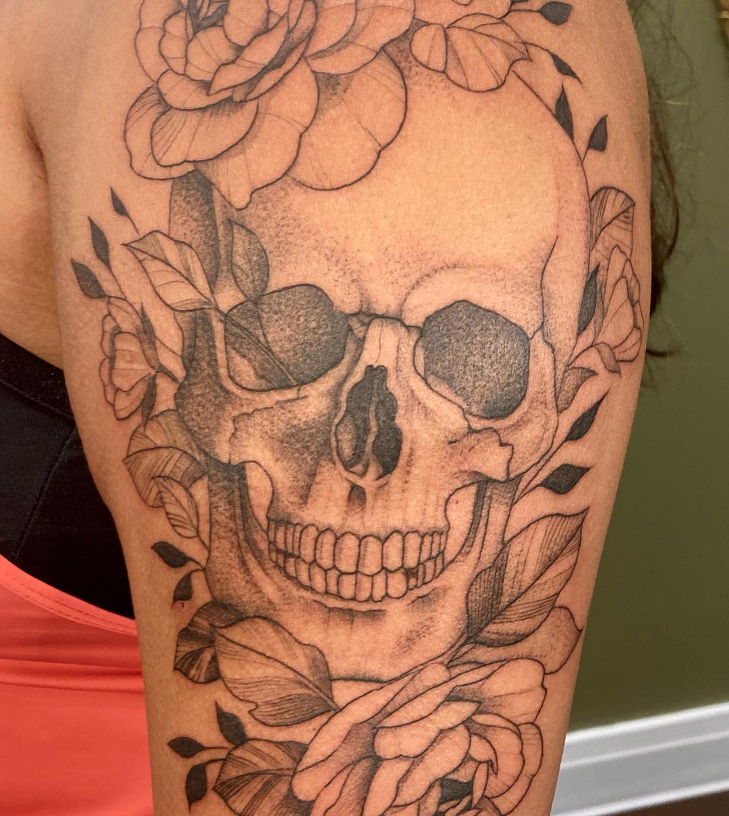Skull and roses realism tattoo on the forearm by Hali Larkin