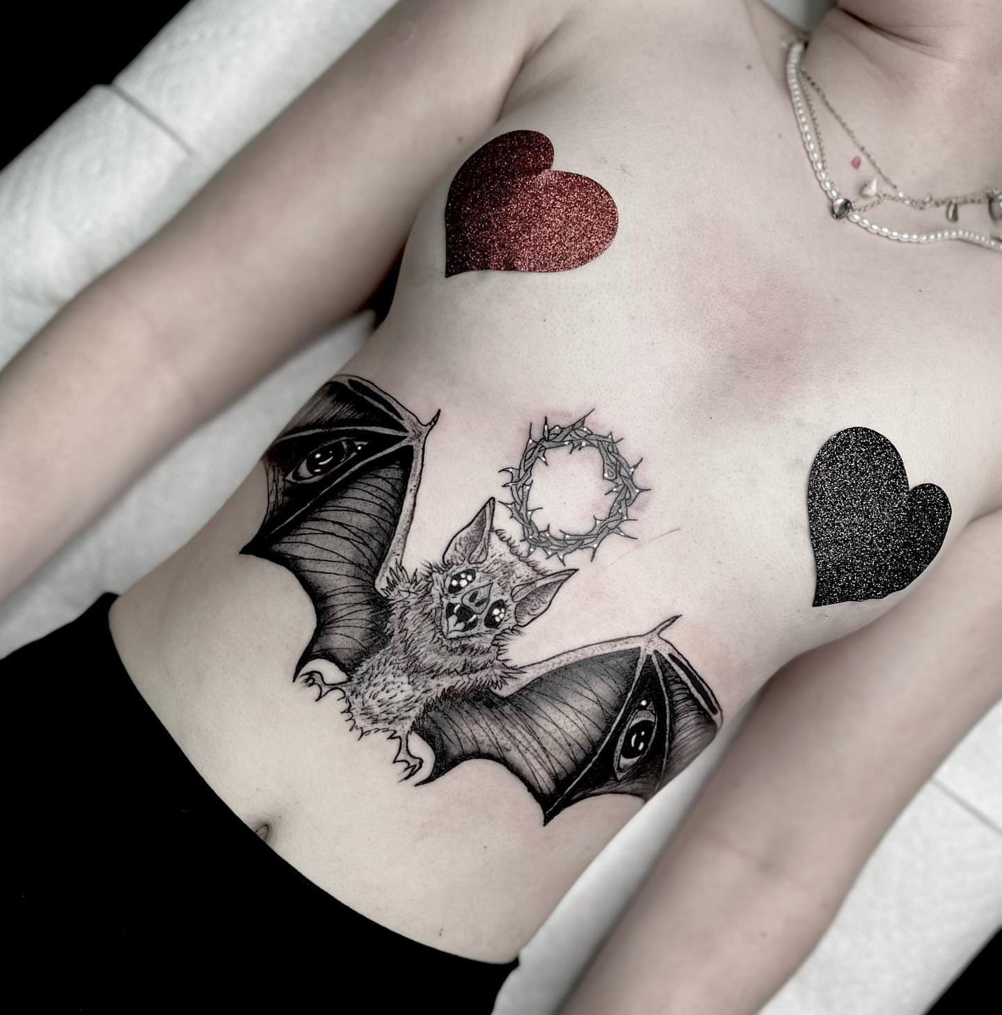 Bat with crown realism tattoo on the ribs by Las Vegas Tattoo ⚡️dark Art⚡️