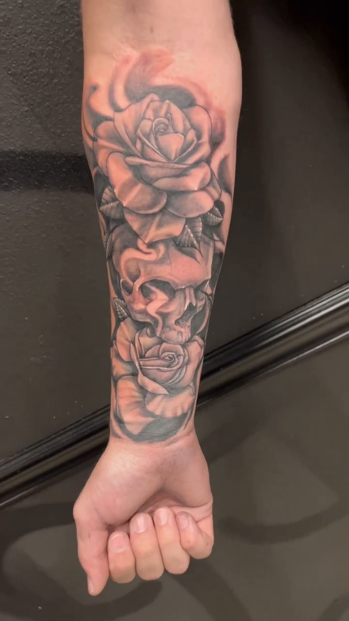 Roses and skulls realism tattoo by Look