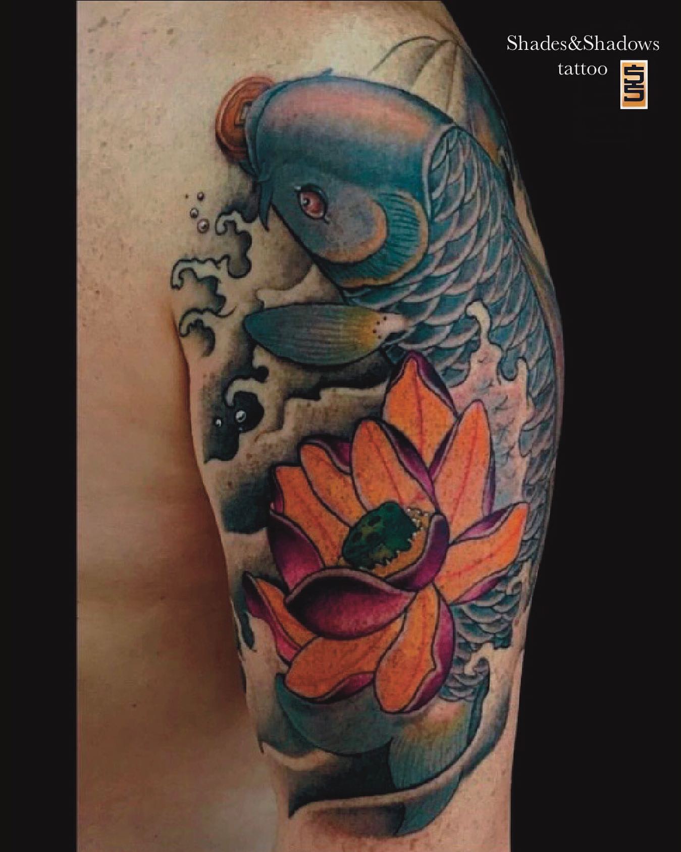 Koi fish and lotus flower japanese irezumi tattoo on the forearm by Austin Tattoo Artist