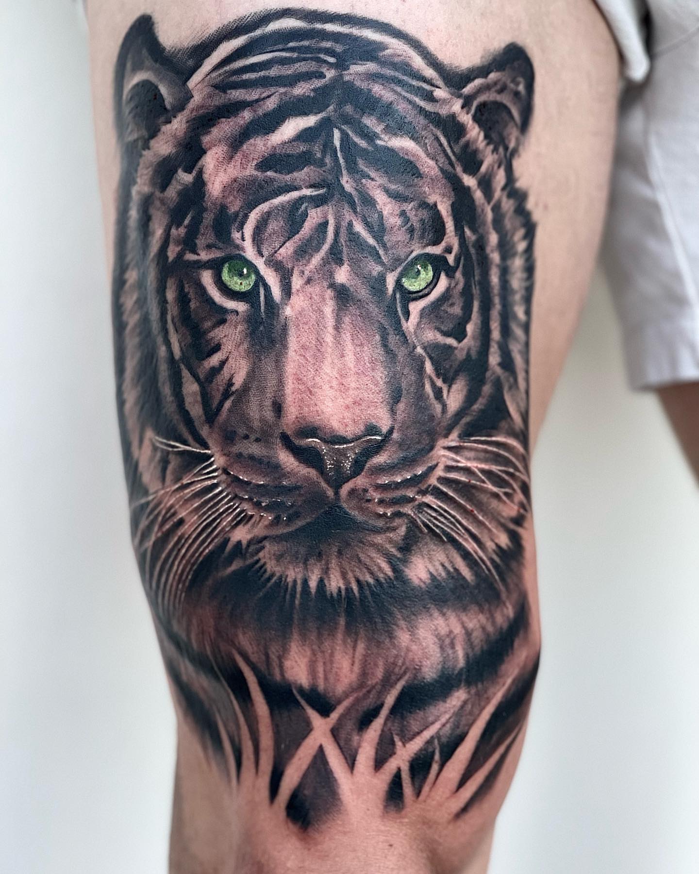 Tiger realism tattoo on the forearm by Peewee Morales