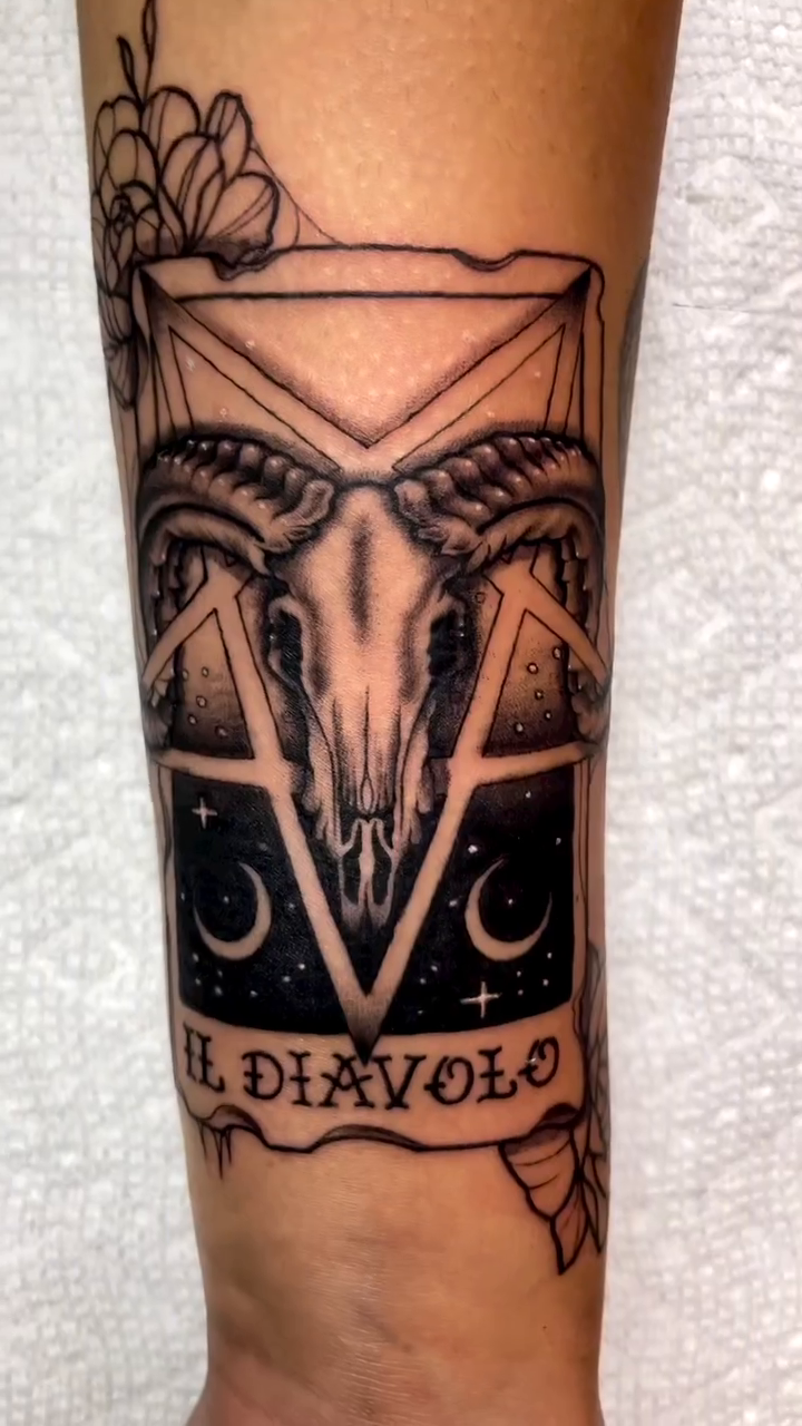 Ram skull with celestial elements dark realism tattoo by Bryan