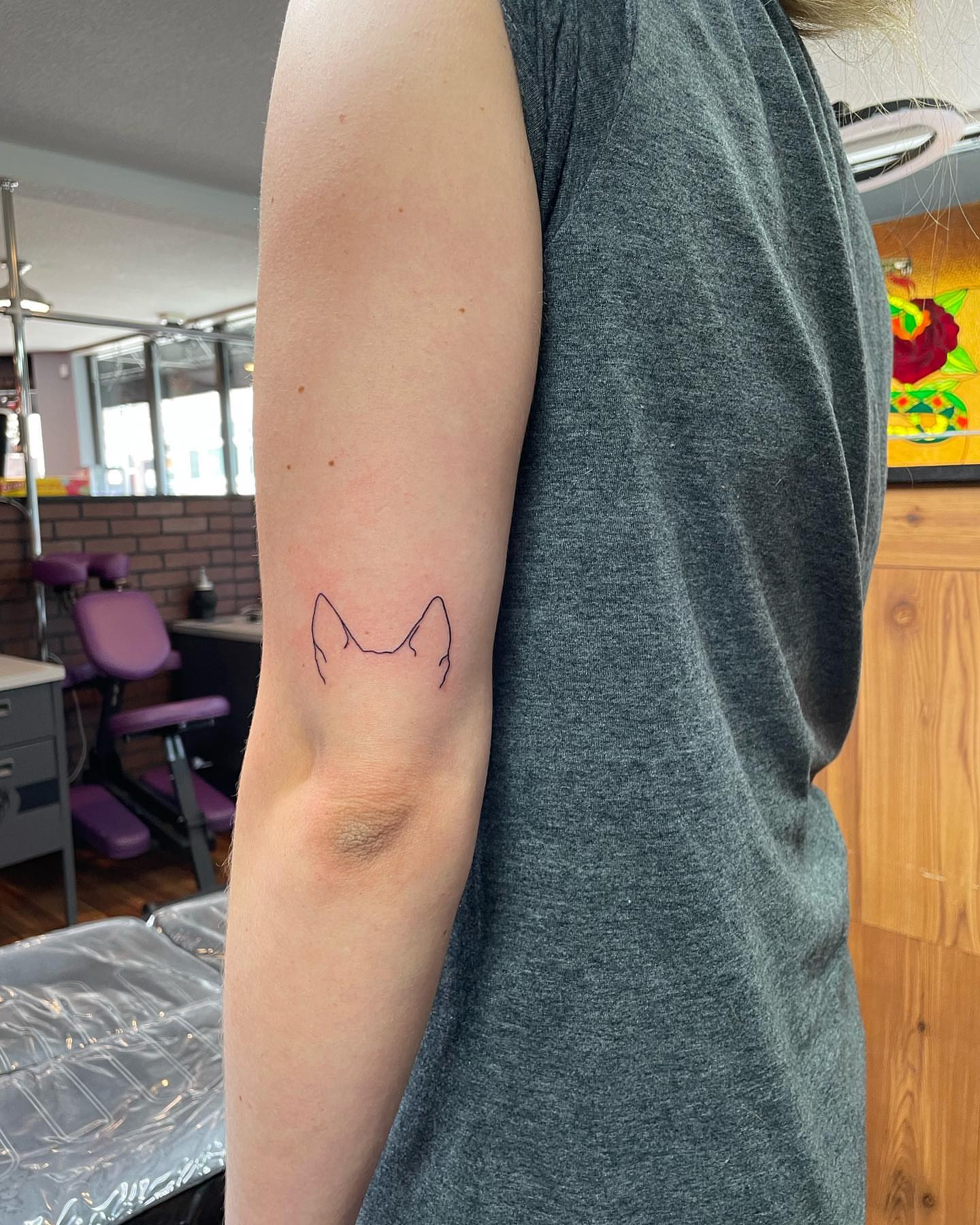 Cat silhouette minimalist tattoo on the forearm by Anna sabrowsky