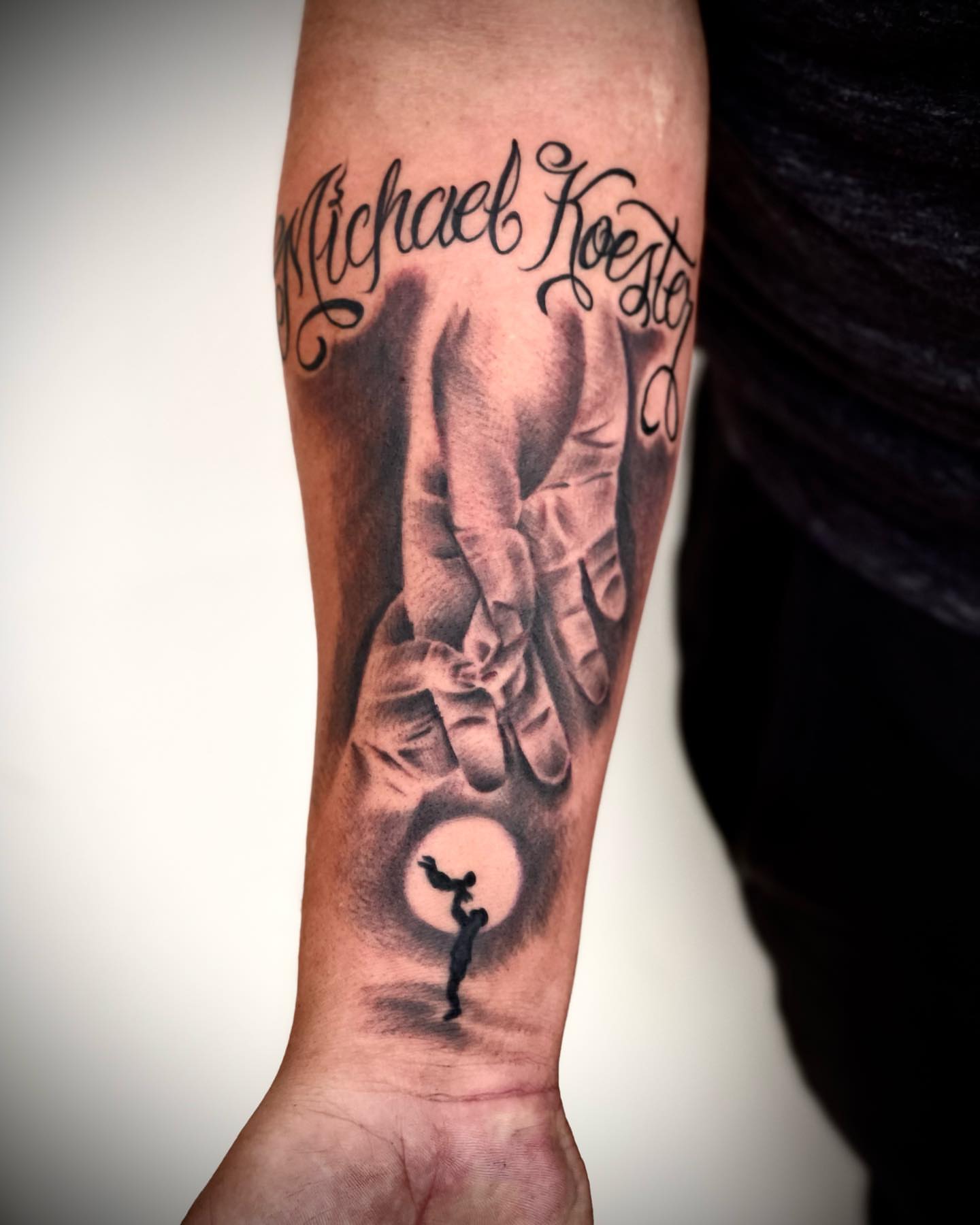 Praying hands with silhouette realism tattoo on the forearm by Peewee Morales