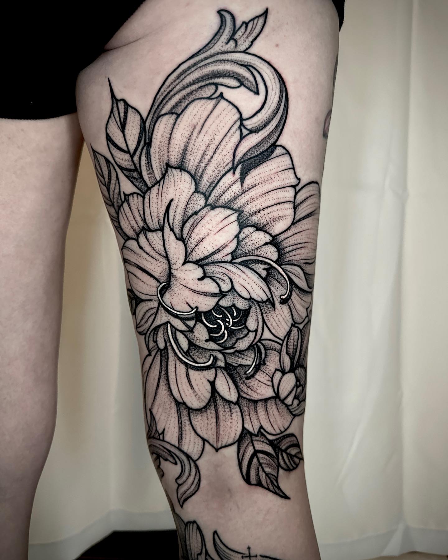 Floral arrangement dotwork tattoo on the thigh by Ty Pallotta, Austin, Texas
