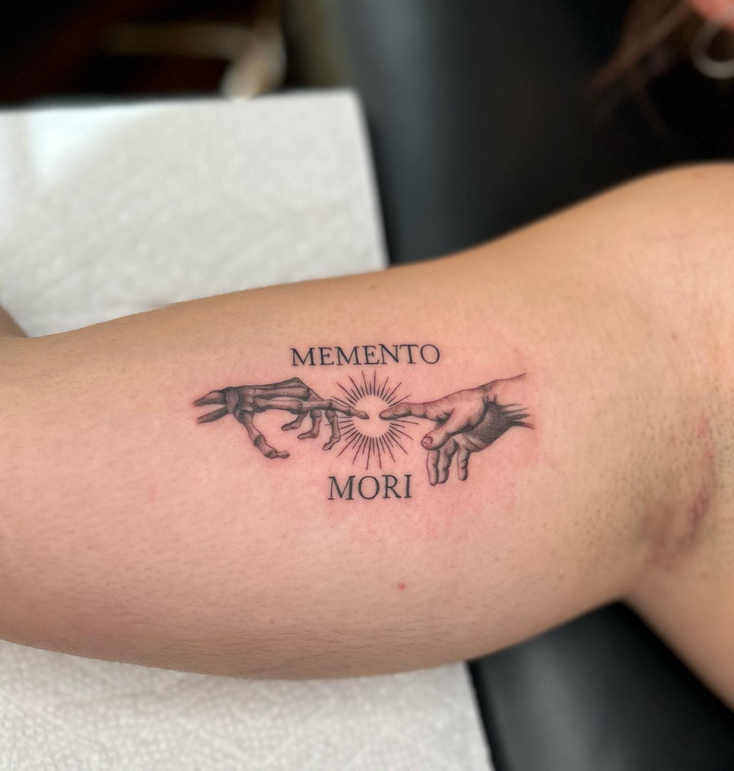 Memento Mori black and grey tattoo on the forearm by Tiffany Bauer
