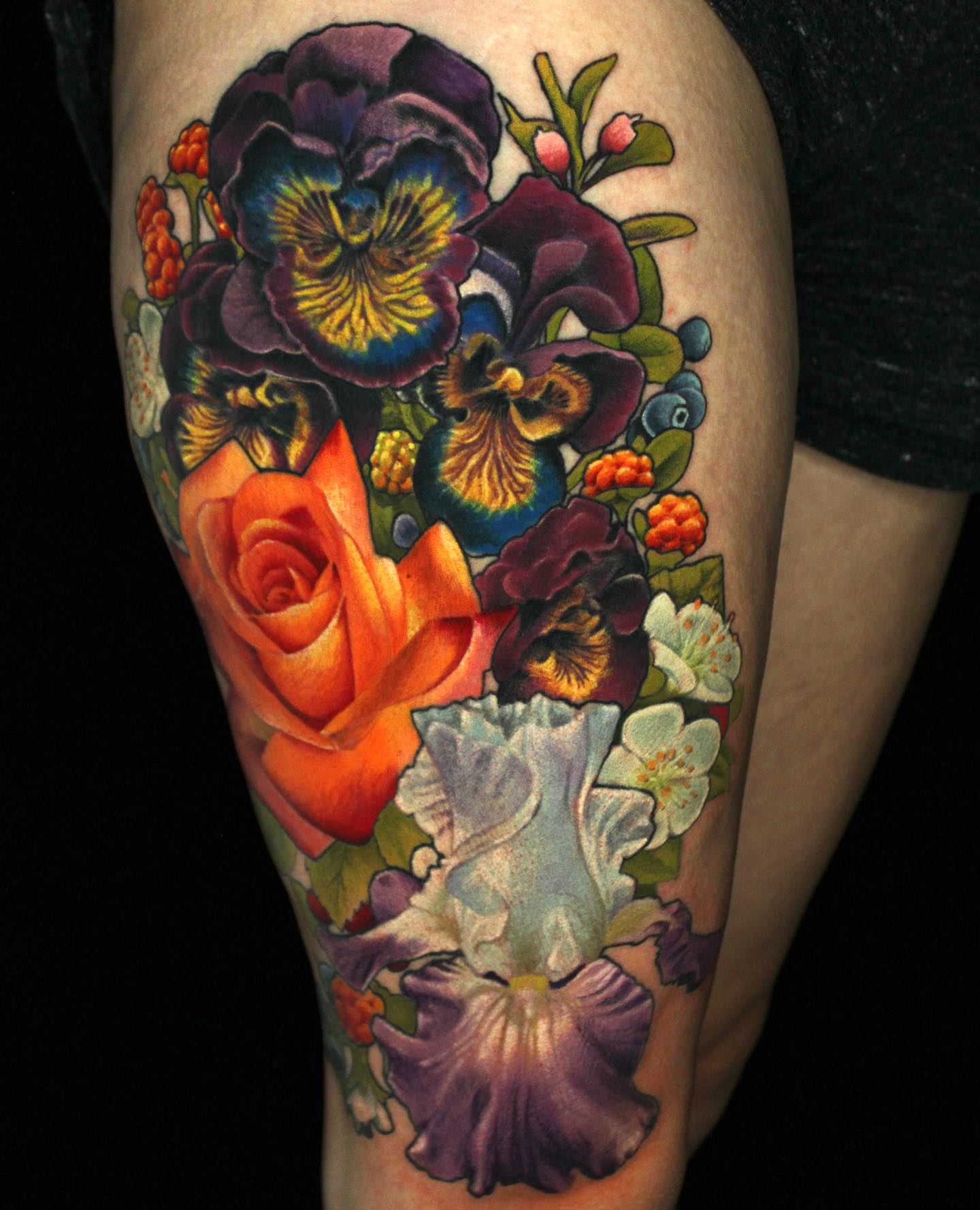 Floral bouquet realism tattoo on the thigh by Ericksen Linn