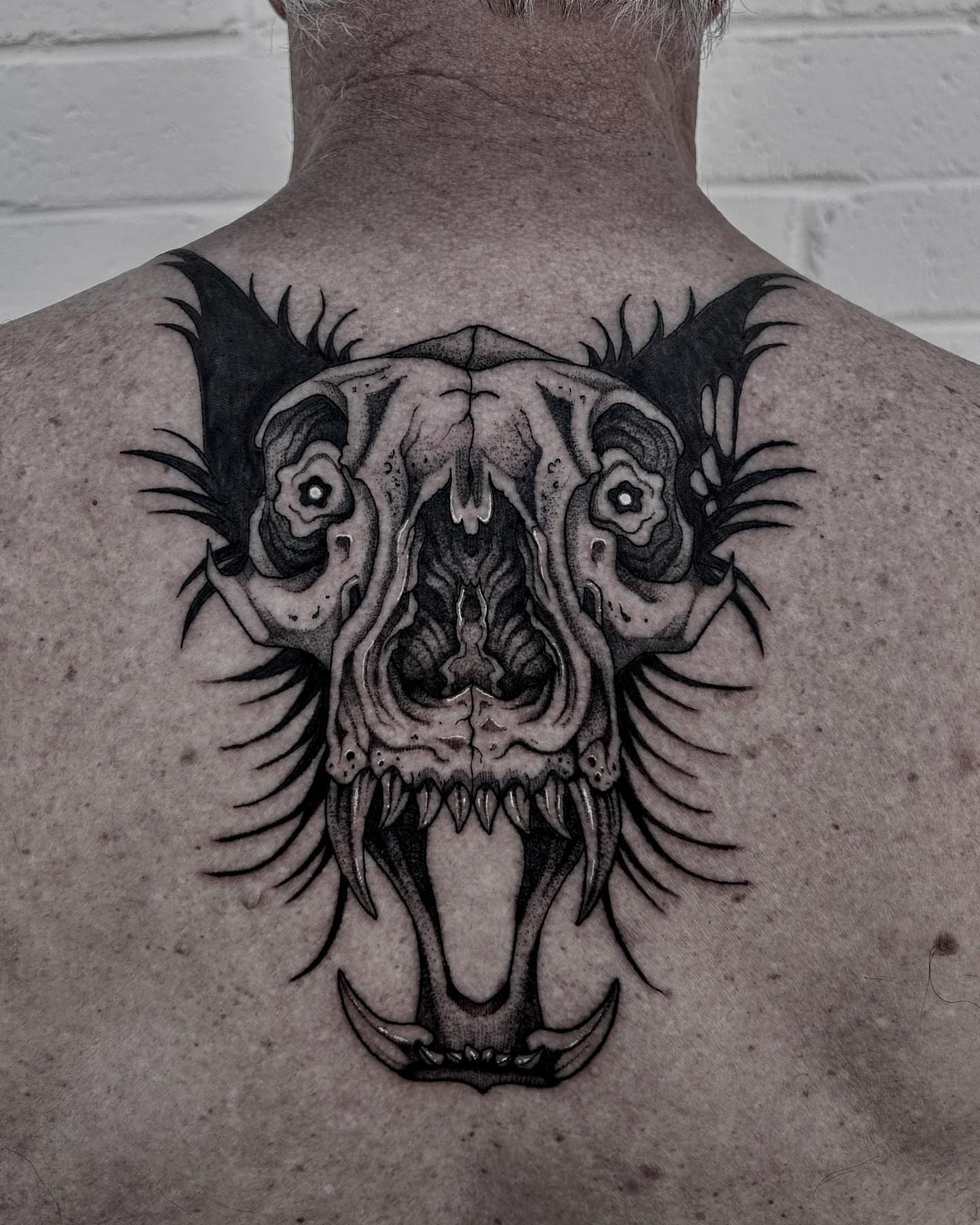 Skull realism tattoo on the back by Melanie