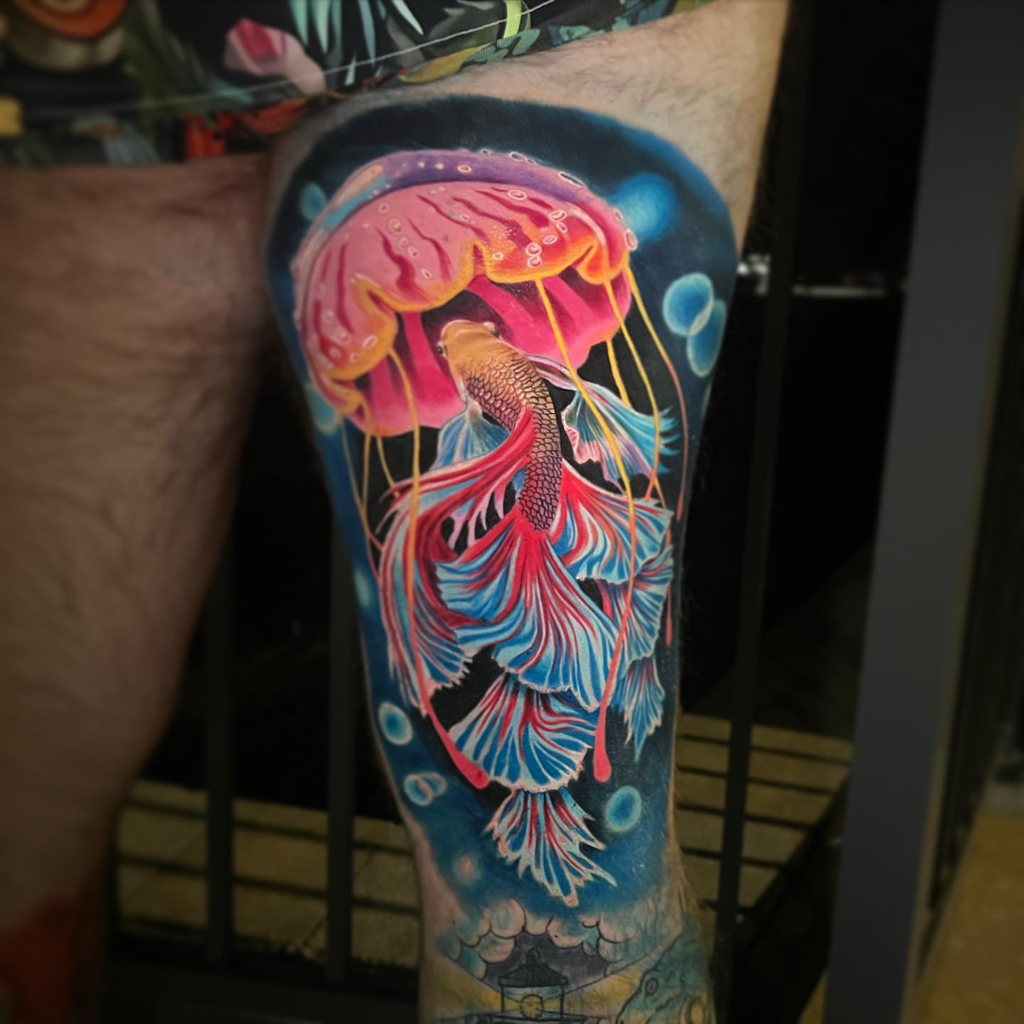 Jellyfish and fish illustrative tattoo on the forearm by Mary Blake Tattoos, Franklin, Tennessee
