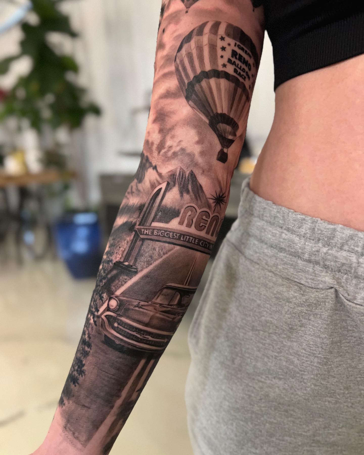Hot air balloon and classic car realism tattoo on the forearm by Anthony Michaels, Tucson, Arizona
