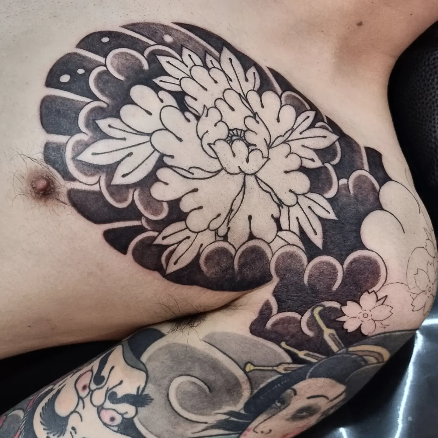 Chrysanthemum black and grey tattoo on the thigh by zamix_traditional, San Francisco, California
