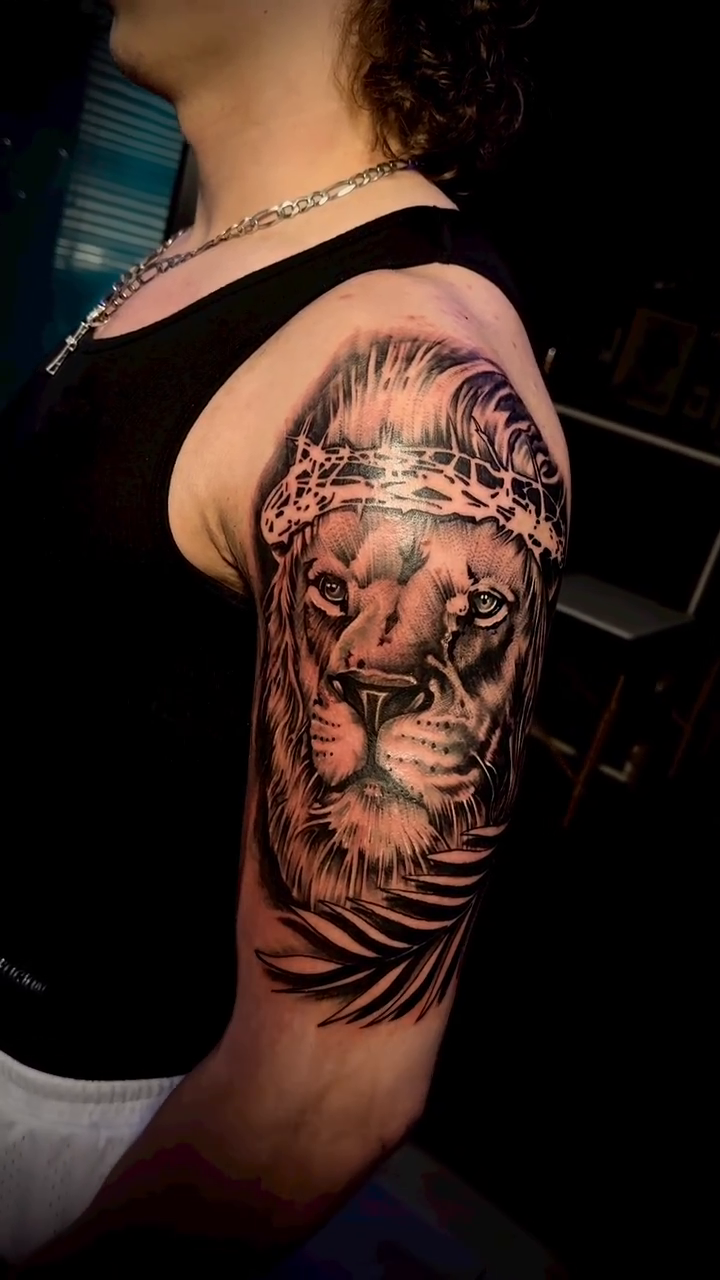 Lion with crown of thorns realism tattoo by Paul burrows (Tatttoo Artist)