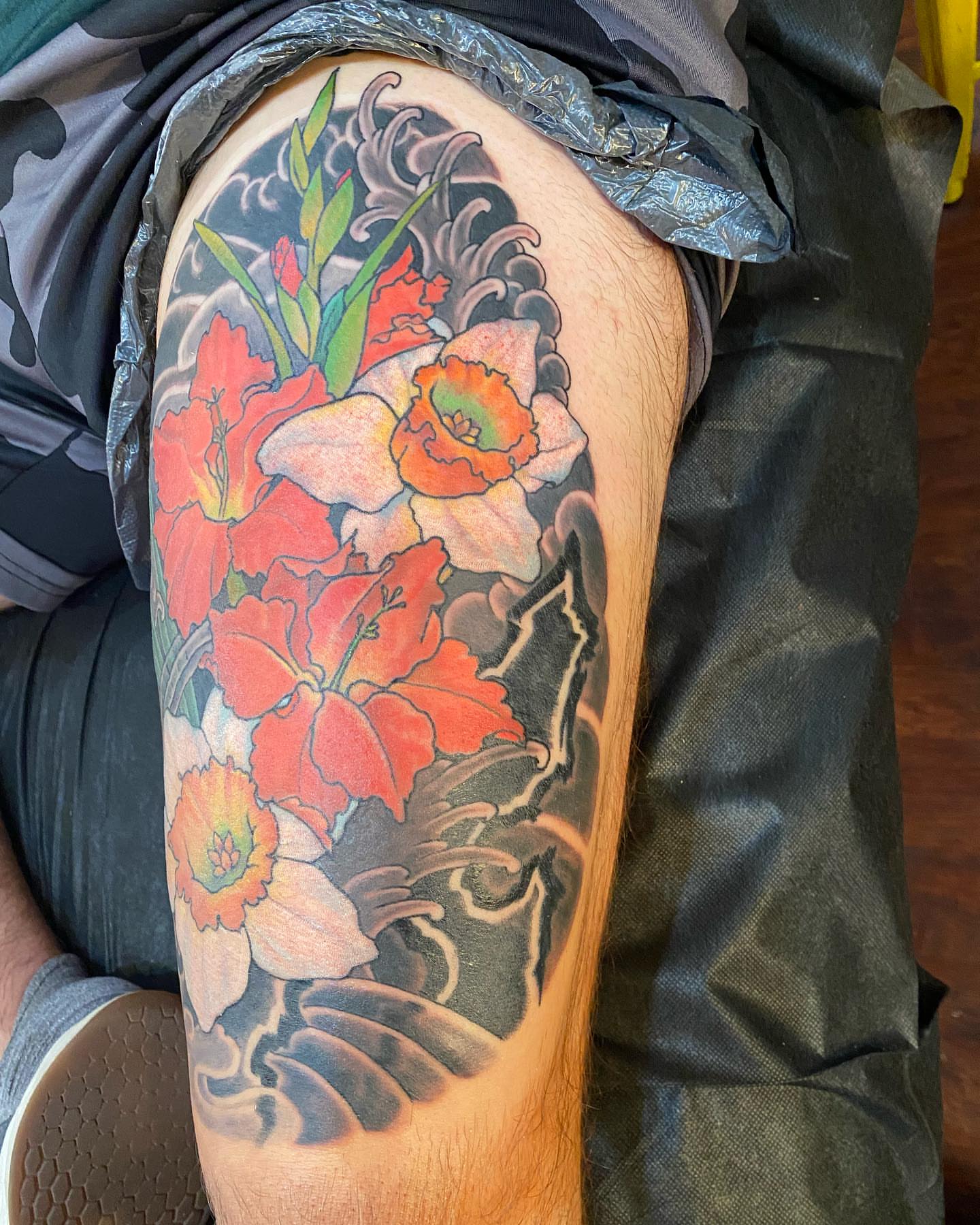 Flowers japanese irezumi tattoo on the thigh by Christopher Sanders
