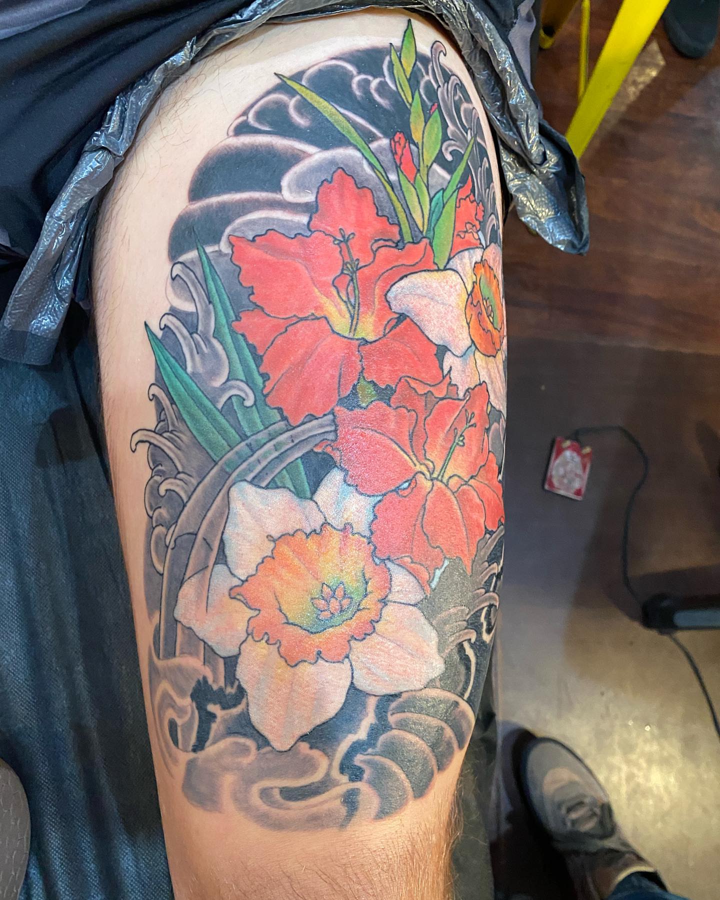 Flowers japanese irezumi tattoo on the thigh by Christopher Sanders