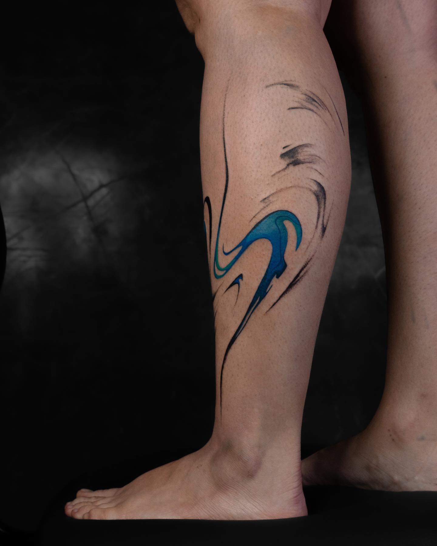 Water wave new school tattoo on the calf by Pietro Moleti