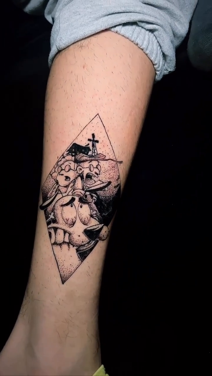 Skull with flowers and a cross dark realism tattoo by Marvin Osorno