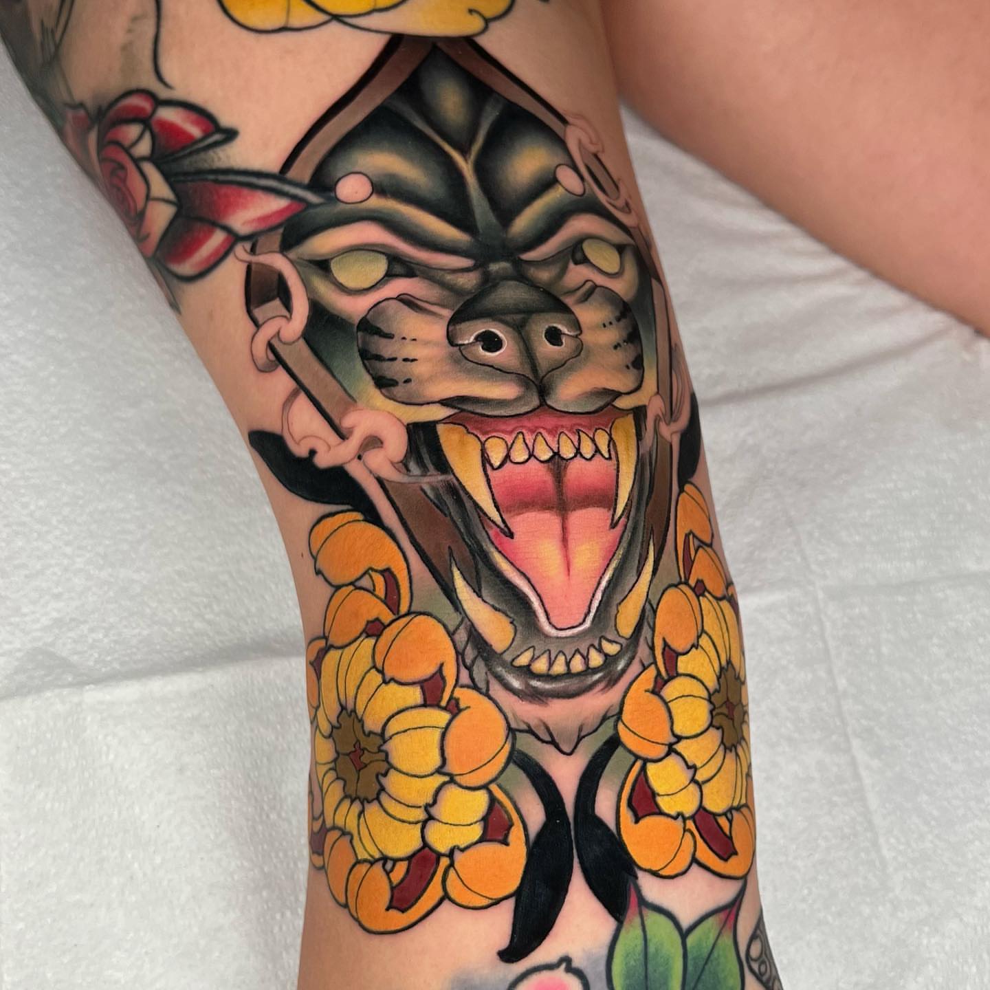 Demon mask surrounded by flowers American traditional tattoo on the forearm by 💢 Anime  & 🗡 Neo Traditional    💥 Marc