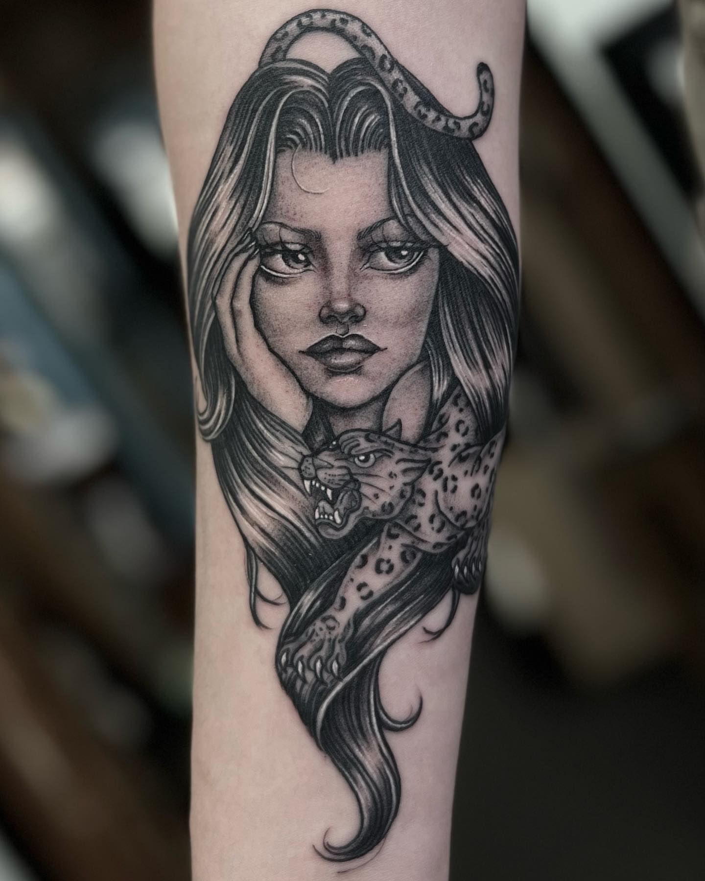 Woman with snake realism tattoo on the forearm by Valerie Dominguez