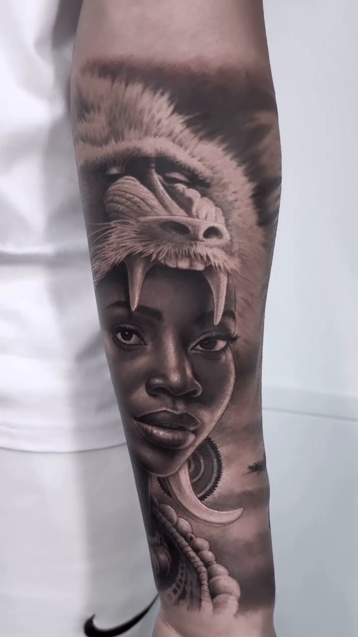 Woman with lion headdress realism tattoo by Jesus Alonso