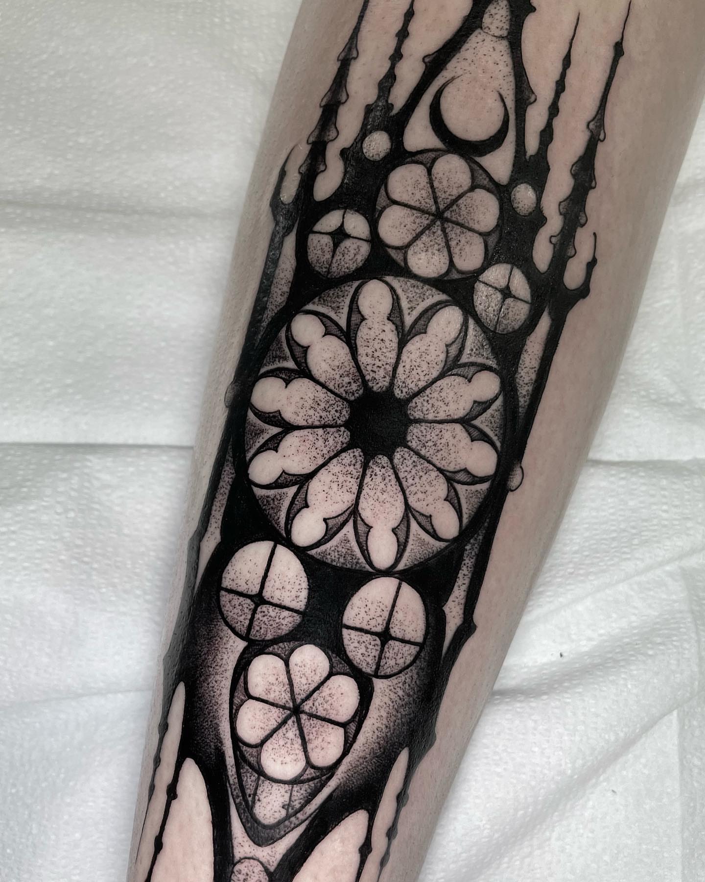 Geometric floral pattern dotwork tattoo on the forearm by Sofia Rose