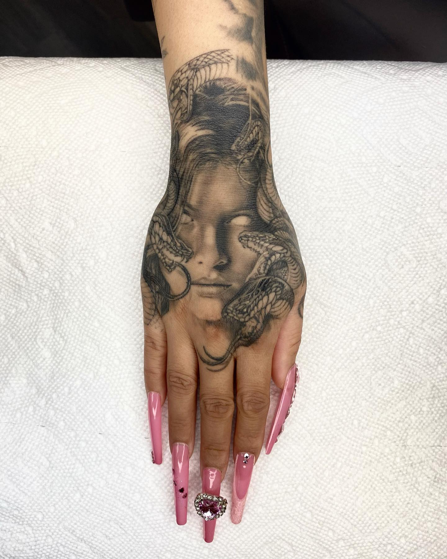 Woman's face realism tattoo on the hand by Gerardo Brawder