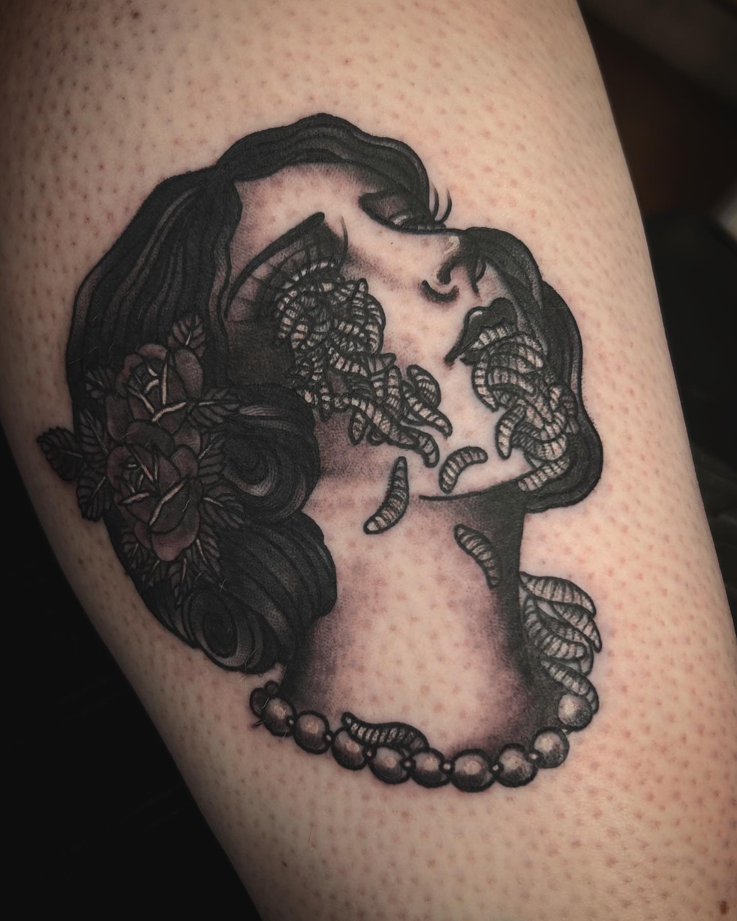 Woman with roses black and grey tattoo on the thigh by Samantha C, Bremerton, Washington