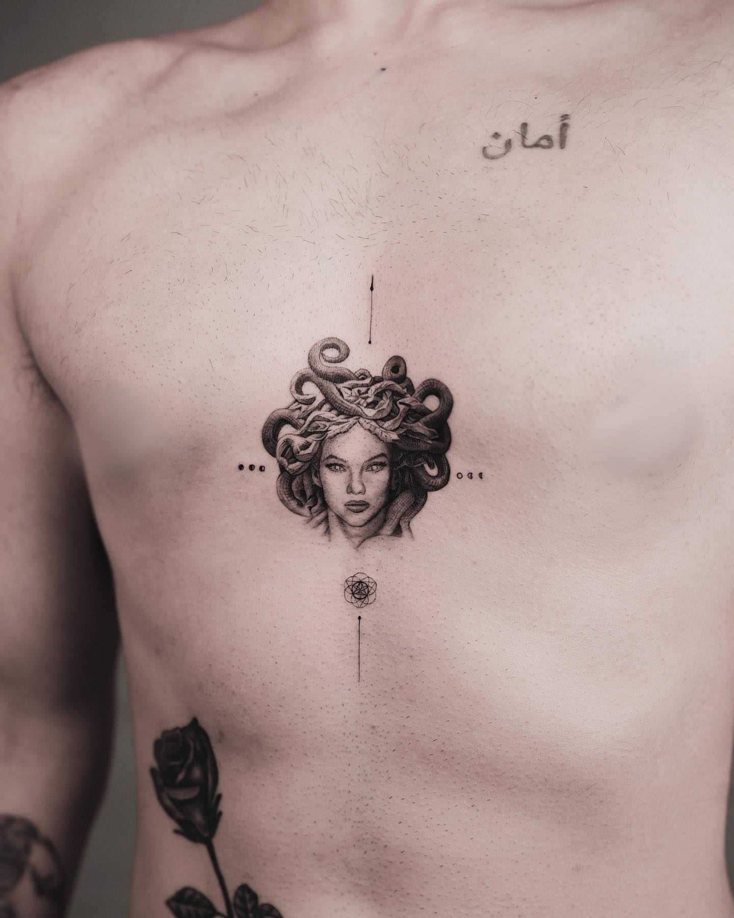 Medusa head dotwork tattoo on the chest by Kid Needle