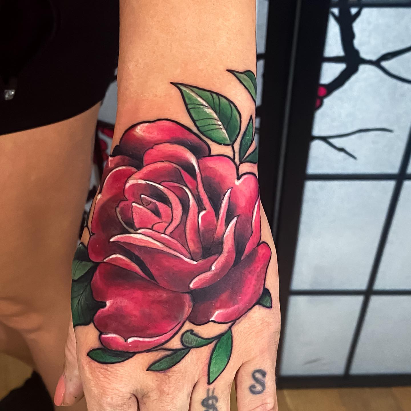 Red rose realism tattoo on the hand by Eric James, Phoenix, Arizona