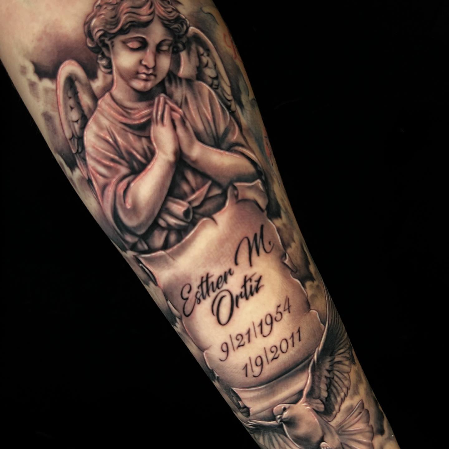 Praying angel realism tattoo on the forearm by Raw Hound, Hialeah, Florida