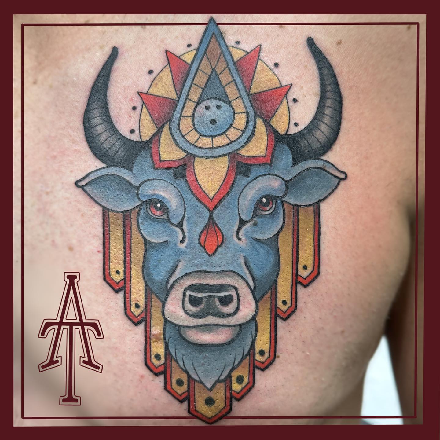 Bull head American traditional tattoo on the chest by Chris Dobransky